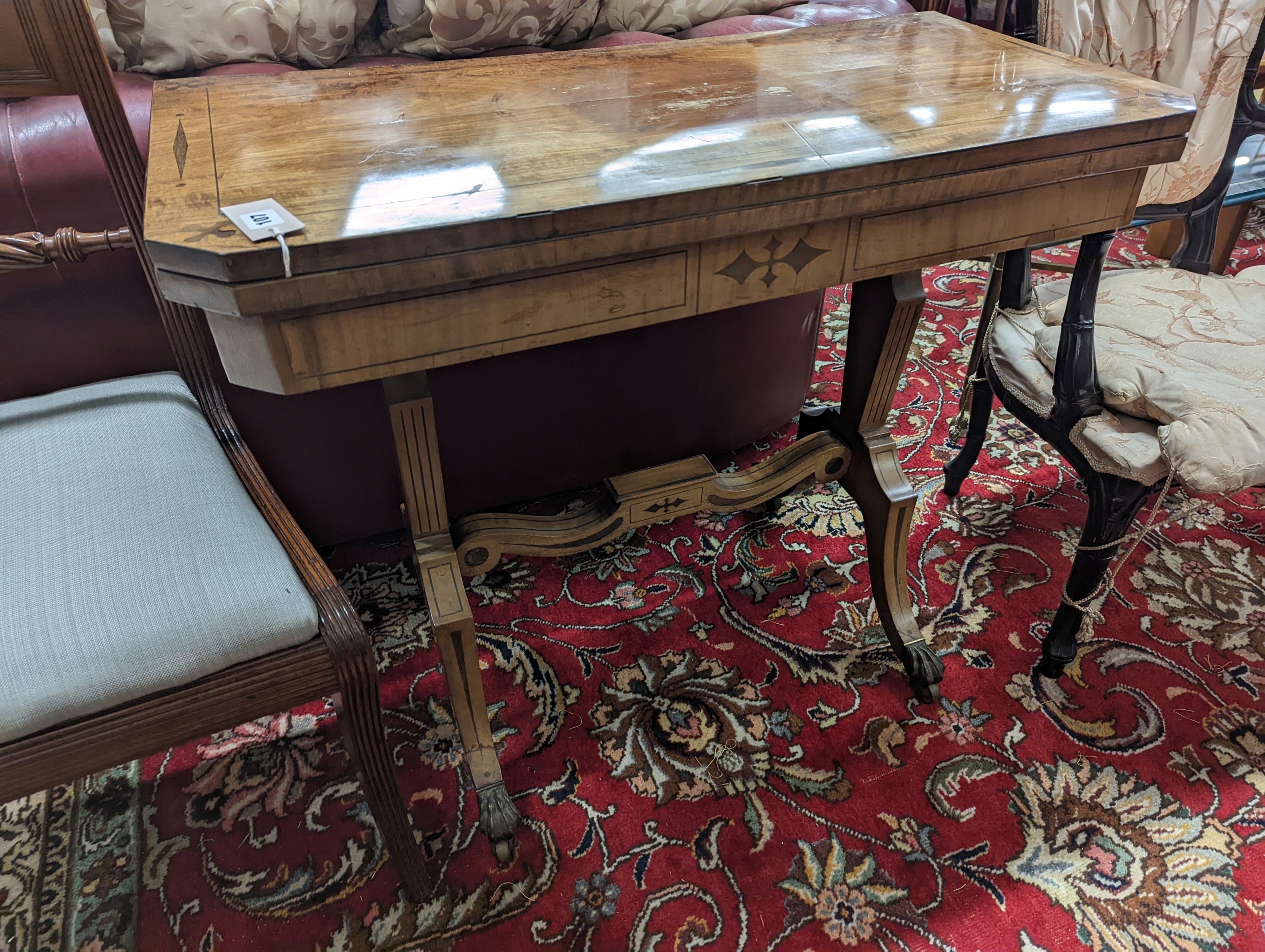 A Regency rectangular inlaid mahogany folding card table, width 91cm, depth 44cm, height 75cm